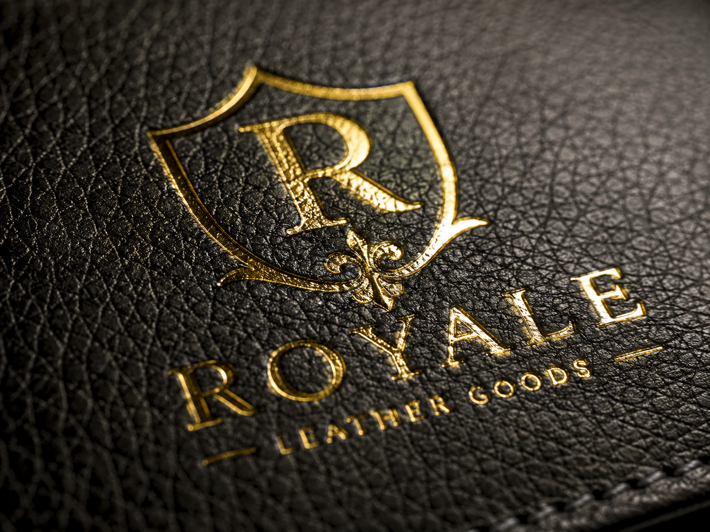 Gold foil debossed on leather macro close-up